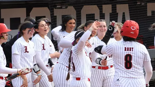 Celebration after Taylor Roby's solo home run against Wisconsin tied the school career home run record