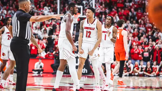 JJ Traynor and Brandon Huntley-Hatfield celebrate against Clemson on Feb. 18, 2023.