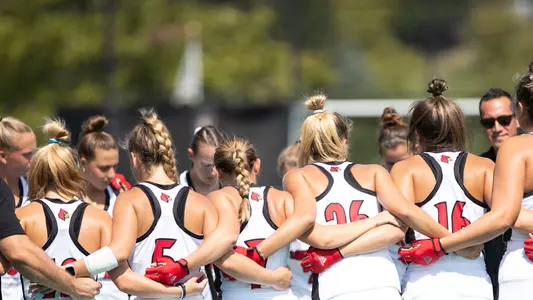 Field hockey team pregame huddle