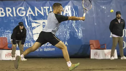 Miguel Avendaño returns the ball in a juniors tournament