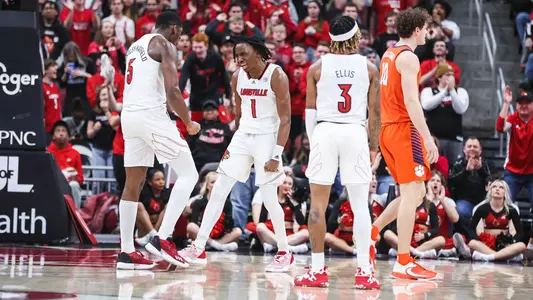 Mike James celebrates with Brandon Huntley-Hatfield against Clemson on Feb. 18, 2023.