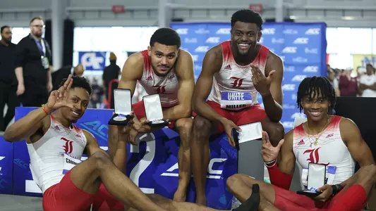 Noah Carmichael, Isiah Pantiere, Cameron Miller, and Robert Joseph celebrate their second-place finish in the 4x400m relay at the ACC Championships