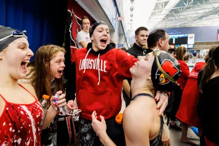 Cardinals cheer on sidelines at ACC meet