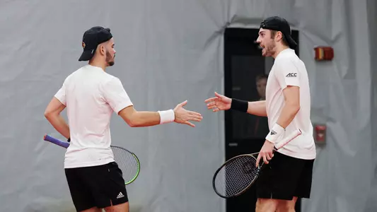 Natan Rodrigues and Fabien Salle celebrate after a point