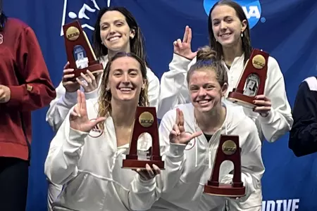 200 free relay pose on the podium