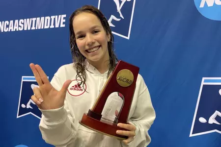 Else Praasterink shows off her trophy for All-American honors on 3M Springboard