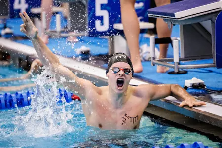 Guy Brooks celebrates a the blocks