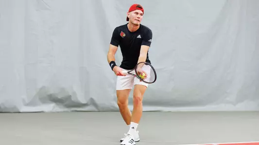 Andre Steinbach serves against Bellarmine