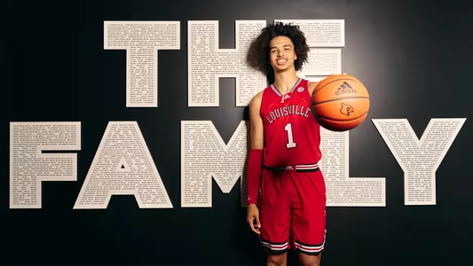 New Louisville men's basketball signee Trentyn Flowers poses in the UofL facility.