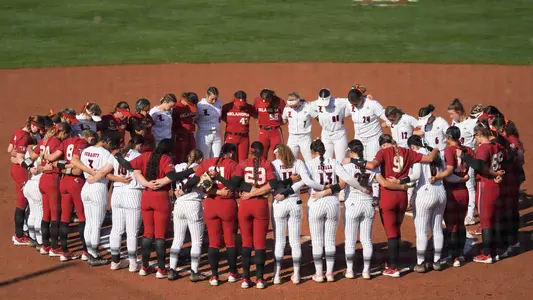 Louisville and Oklahoma post game huddle
