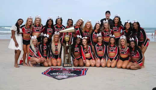 All Girl Cheer pose with their national championship trophy
