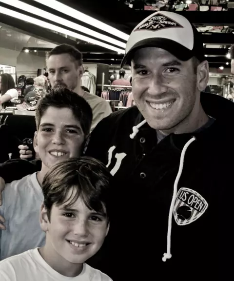 David Mizrahi photographed with his two brothers.