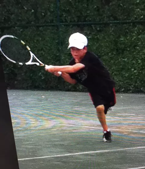 David Mizrahi playing tennis as a child.