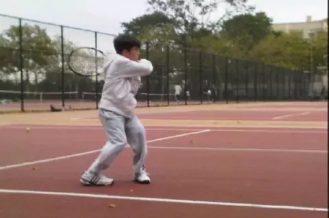 David Mizrahi playing tennis as a child.
