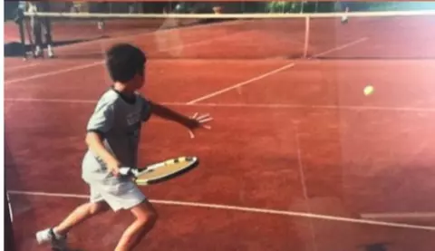 David Mizrahi playing tennis as a child.