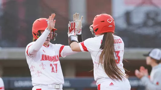 Elana Ornelas and Ally Alexander celebrate Louisville's win over Boston College