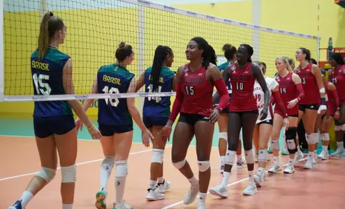 Aiko Jones, Anna DeBeer and Phekran Kong shake hands with the Brazilian National U21 Team