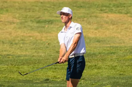 Easton Johnson drives to the greeen