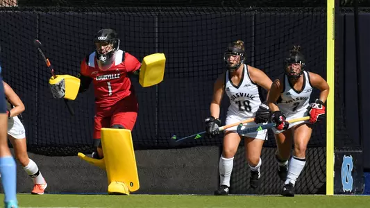 Louisville field hockey prepares to defend a corner against North Carolina