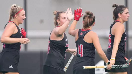 Louisville field hockey celebrates during the win over Northeastern