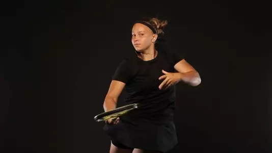 Lillian Mould swings racket