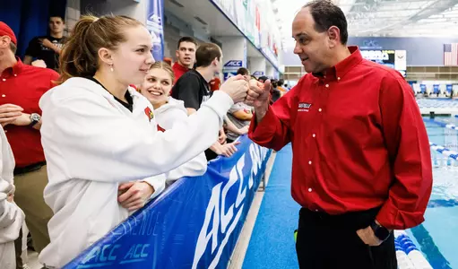 Arthur Albiero congratulates Julia Dennis