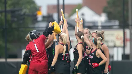 Louisville field hockey huddle