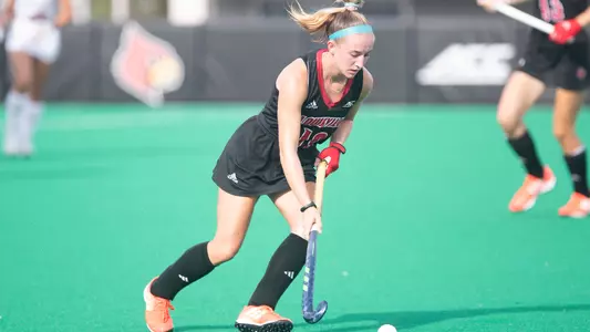 Minna Tremonti dribbles the ball down the field against Northeastern