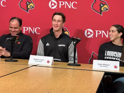 Spring sport media day podium with swimmers Gabi Albiero and Dalton Lowe