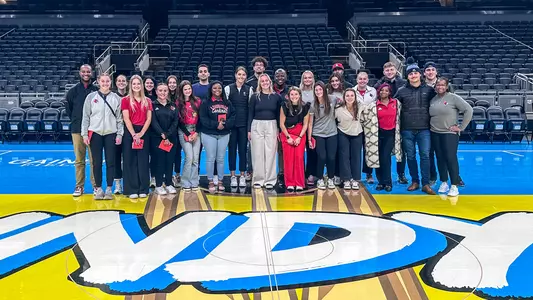 UofL student-athletes and interns pose for a picture during a career exploration trip to Indianapolis.