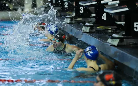 Ella Welch celebrates her win in the 100 breast