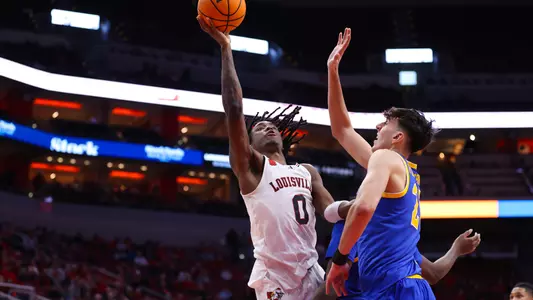 Mike James drives to the basket against Pitt at the KFC Yum! Center on Jan. 6, 2024.