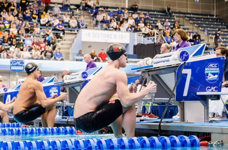 Dalton Lowe pulls up on the block in the backstroke start