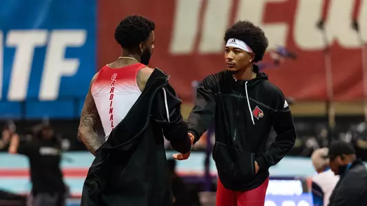 Trey Allen and Brion Stephens shake hands before the 2023 NCAA Indoor Championships.