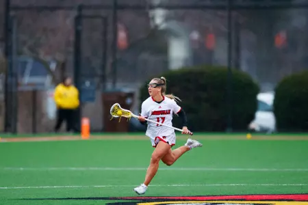 Lauren Figas runs the ball down the field during the game against Marquette on February 16, 2024.