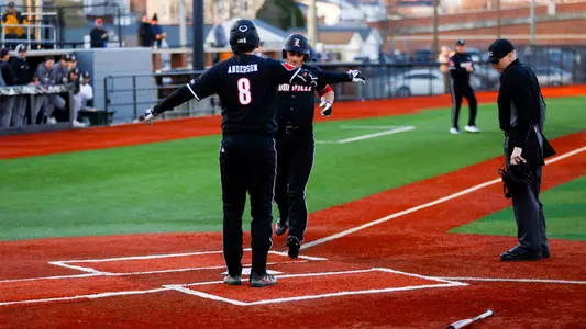 Luke Napleton after hitting a home run against St. Bonaventure.