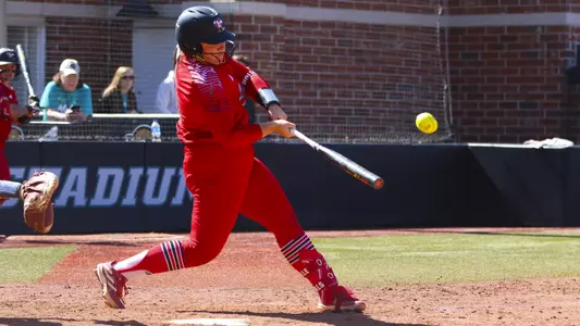 Gabby Holloway hits the ball against Furman