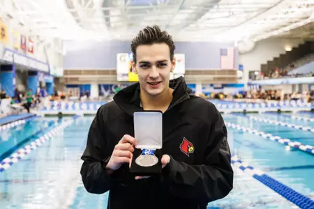 Denis Petrashov poses with his silver in the 200 breaststroke