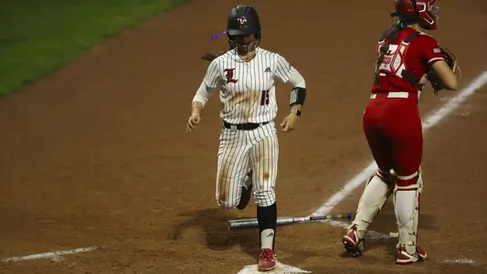Mia Forsythe scores a run in the 8-5 win over South Dakota