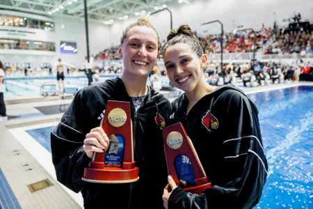Christy Regenauer and Gabi Albiero Show off their NCAA trophies for the 100 freestyle