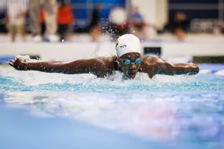Tristen Ulett swims the fly