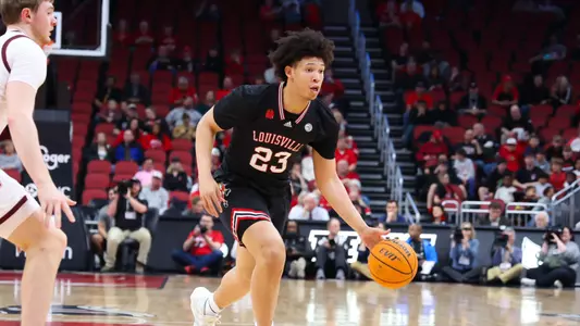 Zan Payne drives the ball against Virginia Tech on March 5, 2024, at the KFC Yum! Center.