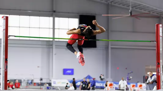 Brion Stephens clears the bar in the high jump at the ACC Indoor Championships