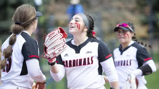 Brooke Gray and Maddi Grant celebrate at the end of an inning against Florida State