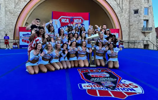 The All-Girl Squad pose with their National Championship Trophy