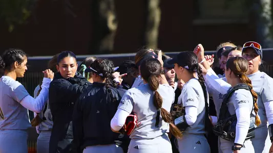 Louisville softball team huddle