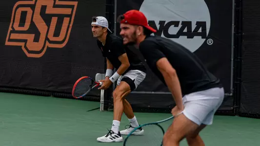 Etienne Donnet and Natan Rodrigues receiving a serve in the 2024 NCAA Men's Tennis Doubles Championship Quarterfinal in Stillwater, Okla., on May 23, 2024
