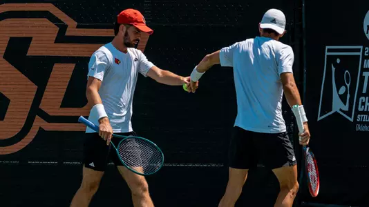 Etienne Donnet & Natan Rodrigues high five at the NCAA Doubles Championship semifinals in Stillwater, Okla., on May 24, 2024