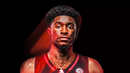 Kobe Rodgers signing photo for men's basketball