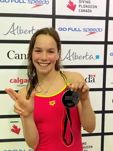 Else Praasterink throws up her L after making the podium in platform at the Canada Cup